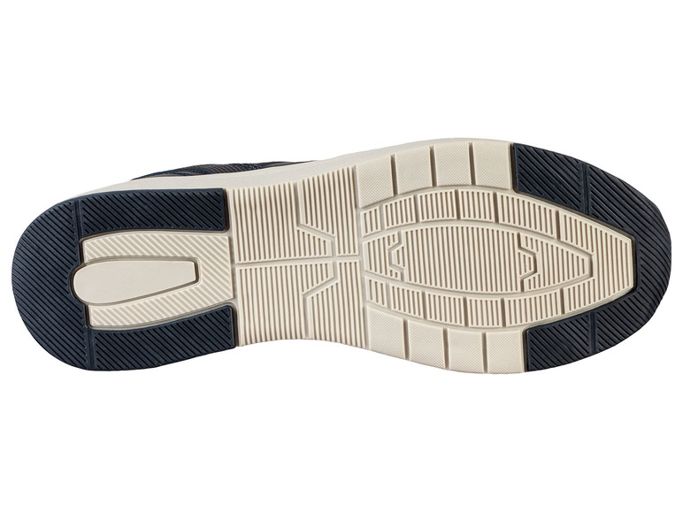 Die Unterseite eines dunkelblauen Sneakers mit weißer Sohle.