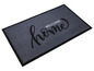 Graue Fußmatte mit dem Schriftzug 'Welcome home'