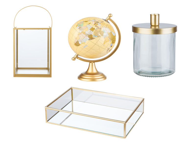 Eine goldene Erdkugel, ein Glasgefäß mit goldenem Deckel, eine rechteckige Glasbox und eine Glaslaterne mit goldenem Rahmen.