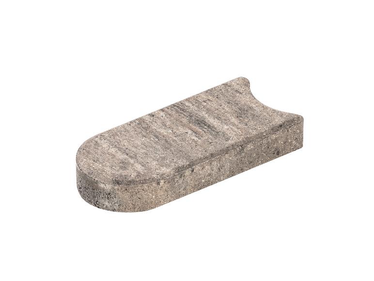 Graue Beton-Gartenkante mit abgerundetem Ende und einer Kerbe