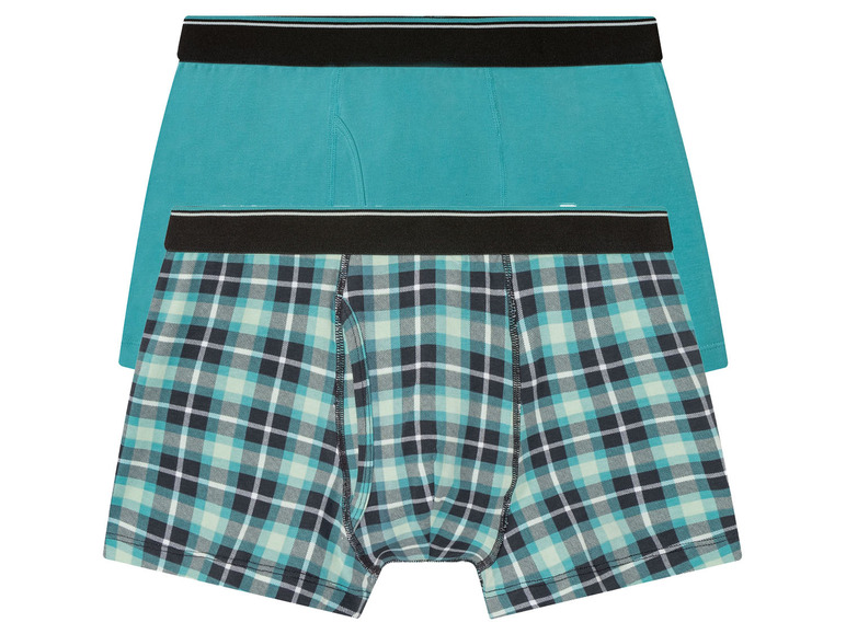 Zwei Boxershorts, eine einfarbig türkis und eine kariert.