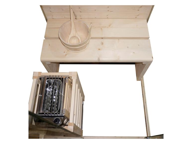 Sauna-Innenraum mit Holzbank, Eimer und Ofen.