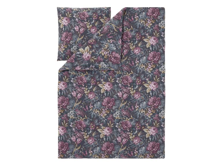 Florale Bettwäsche mit Bettbezug und Kissenbezug auf dunkelgrauem Hintergrund.
