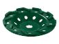 Eine grüne Schleif- oder Trennscheibe mit Löchern