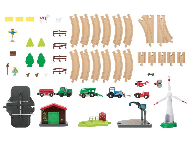 Bauernhof-Spielzeugeisenbahn-Set mit Schienen, Fahrzeugen und Zubehör.