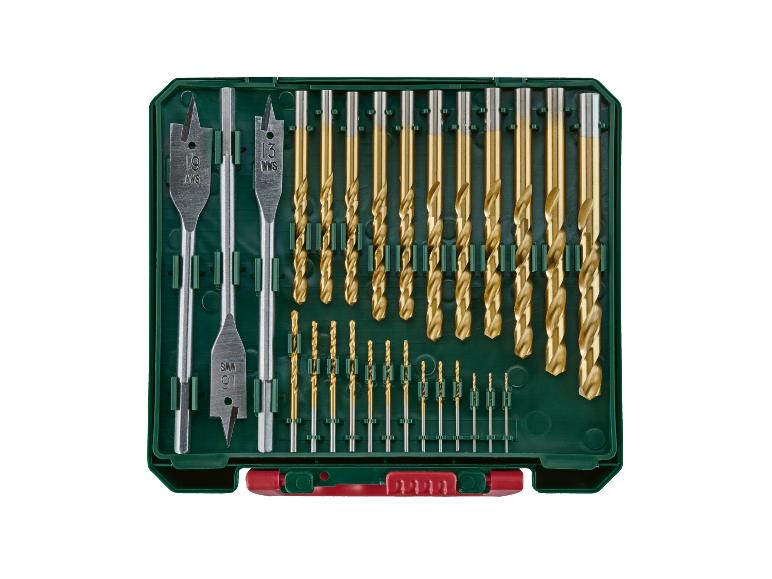 Goldene Bohrer und silberne Flachfräsbohrer in grüner Box.