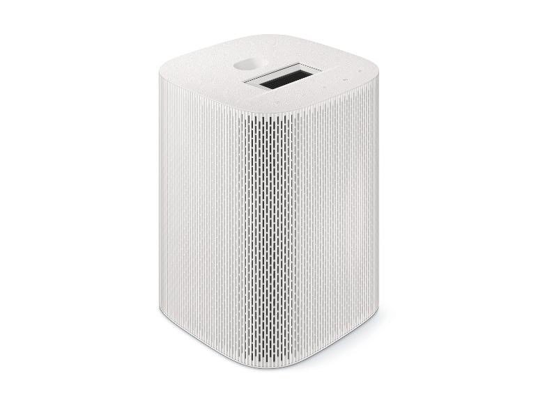 Weißer Smart Speaker mit Display und Touch-Bedienelementen oben.