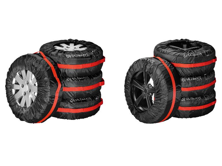 Zwei Stapel Reifen mit schwarzen Abdeckungen und roten Gurten, mit Ultimate Speed Logo.