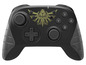Ein schwarzer Nintendo Switch-Controller mit goldenem Zelda-Logo.