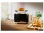 Schwarzer Toaster 1995 mit Brot darauf.