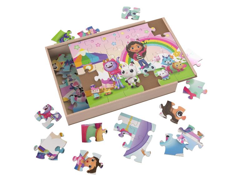 Gabby's Dollhouse Holzpuzzle mit verstreuten Teilen.