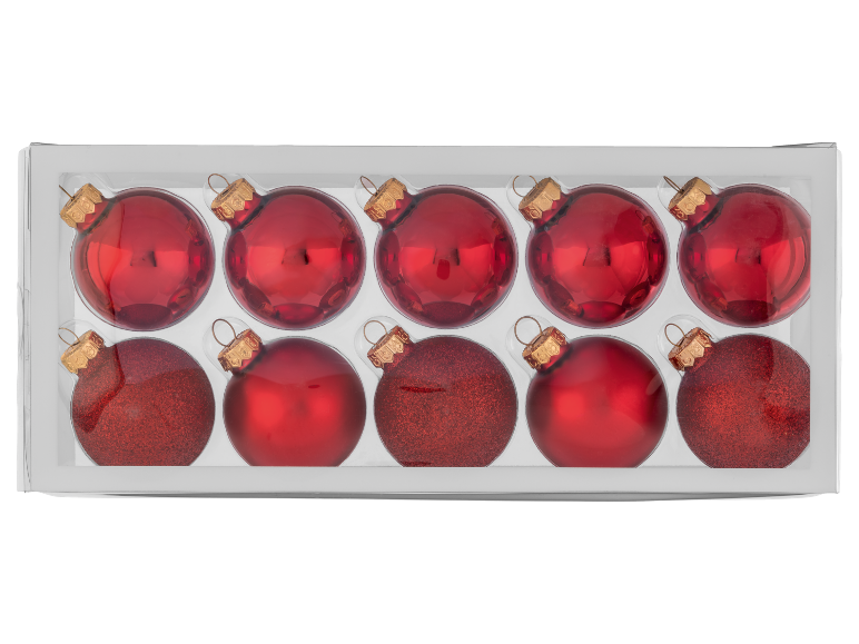 Rote Weihnachtskugeln mit glänzender und glitzernder Oberfläche in transparenter Box.