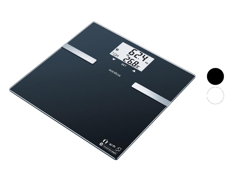 Eine schwarze Smart-Waage zeigt Gewicht und Körperfettanteil an, mit Konnektivitätssymbolen.