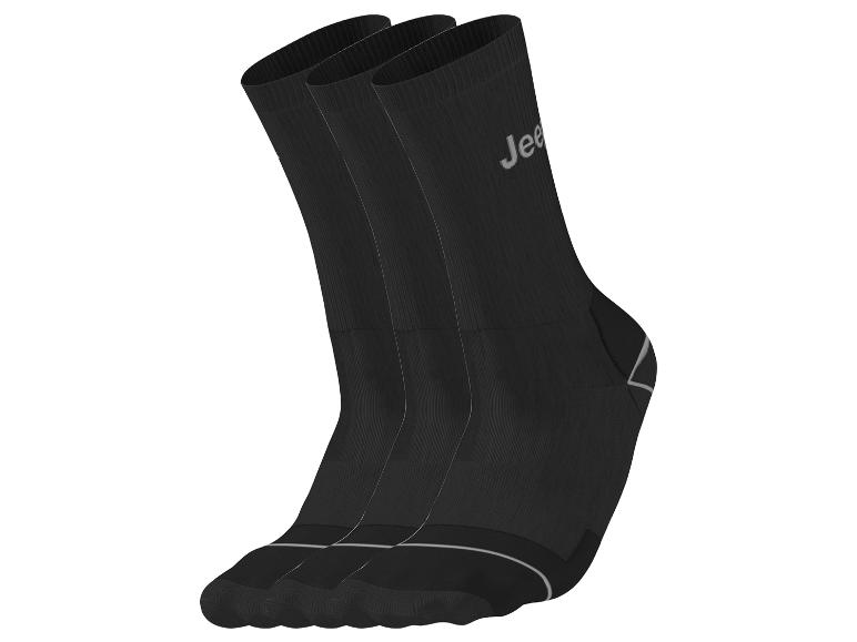 Drei schwarze Jeep-Socken mit weißen Streifen und Logo.