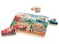 Holzpuzzle mit Transportmitteln: Zug, Auto, Boot, Helikopter und Motorrad.