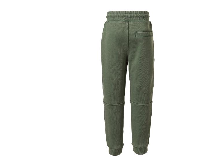 Grüne Jogginghose mit Gesäßtasche und Nahtdetails.