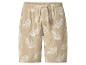 Beige Musselin-Shorts mit weißem Blattmuster und Kordelzug.