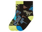 Zwei Paar Socken mit Dinosauriern und dem Jurassic World Logo.