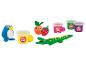 Play-Doh Spielzeug, darunter ein Krokodil, ein Pinguin, Obst und Play-Doh-Dosen.
