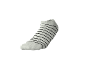 Weißer Socken mit schwarzen Querstreifen.