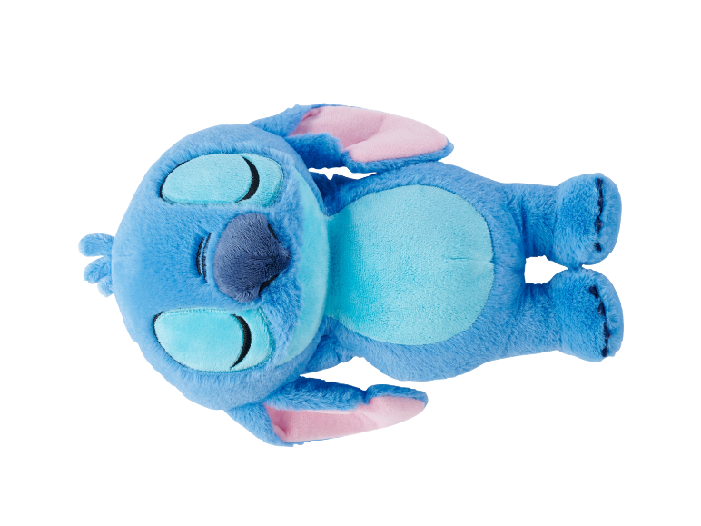 Weiches blaues Plüschtier mit geschlossenen Augen, auf dem Rücken liegend.