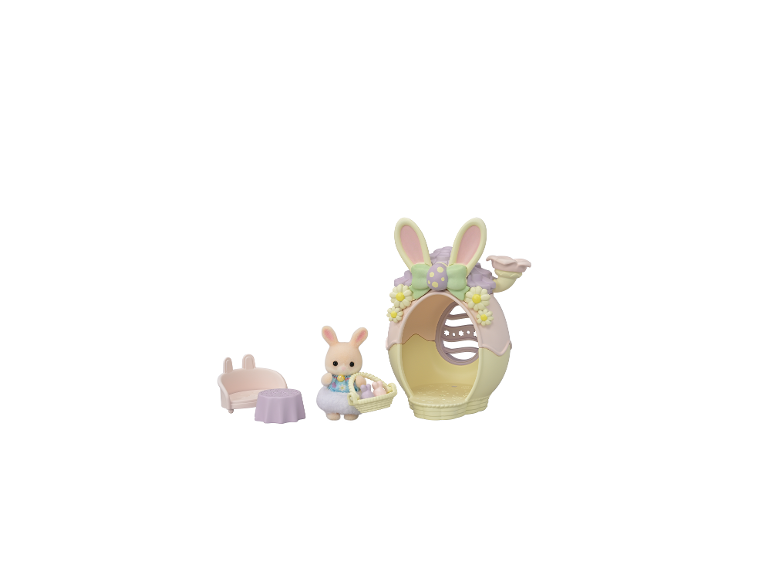 Osterspielzeug-Set mit Hasenfigur, Eierkorb und Eierhaus.
