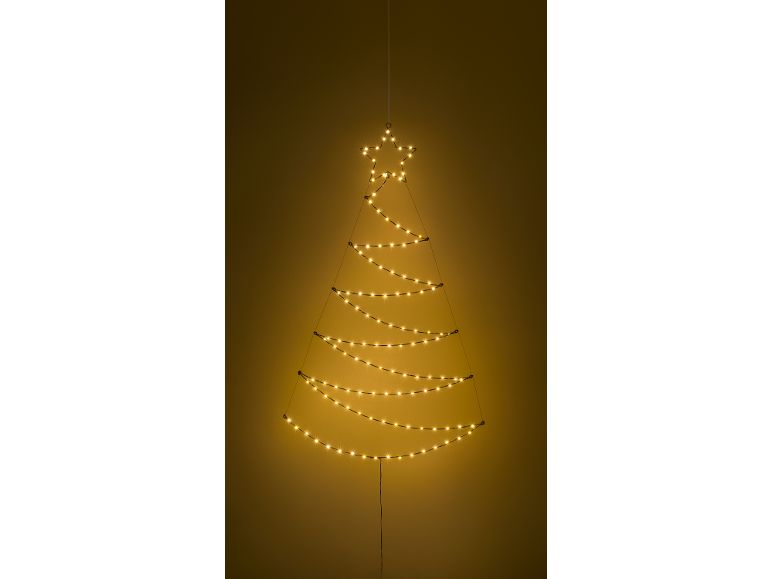 Beleuchtete Weihnachtsbaum-Wanddekoration mit Sternspitze, warm leuchtend vor dunklem Hintergrund.