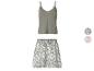 Damen-Pyjama-Set mit grünem Spaghettiträger-Top und gemusterten Shorts.