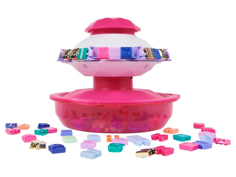Ein rosafarbenes Spielzeugset zum Herstellen von Armbändern mit bunten Gliedern.