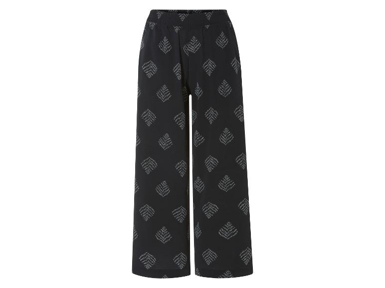 Schwarze weite Hose mit Blättermuster.