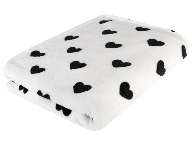 Weiße Decke mit schwarzen Herzen
