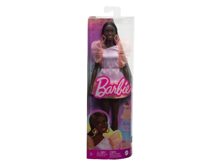 Barbie Puppe mit einem rosafarbenen Kleid und Tüllärmel.
