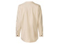 Eine cremefarbene Baumwollbluse mit langen Ärmeln.