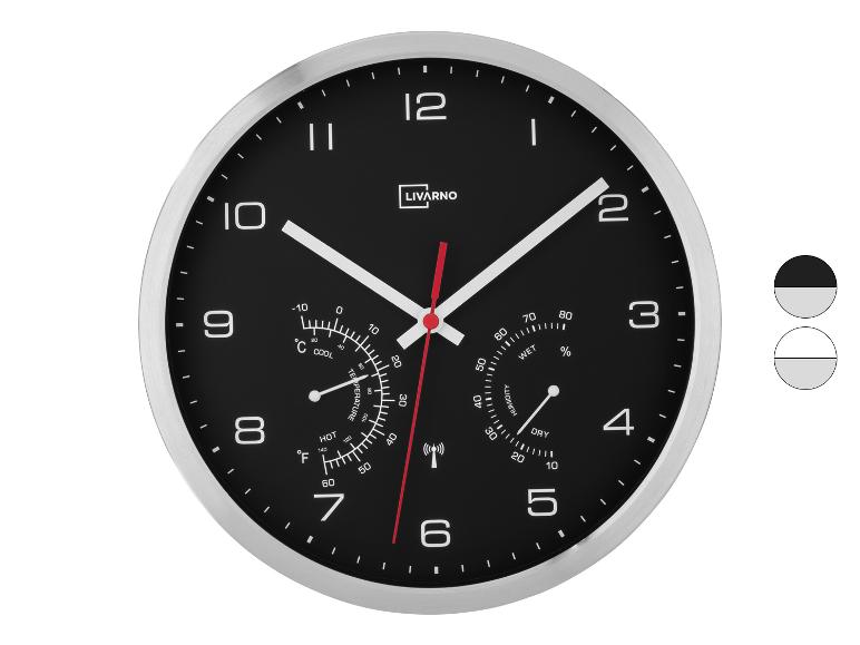 Schwarze Wanduhr mit Thermometer und Hygrometer, mit LIVARNO-Logo.