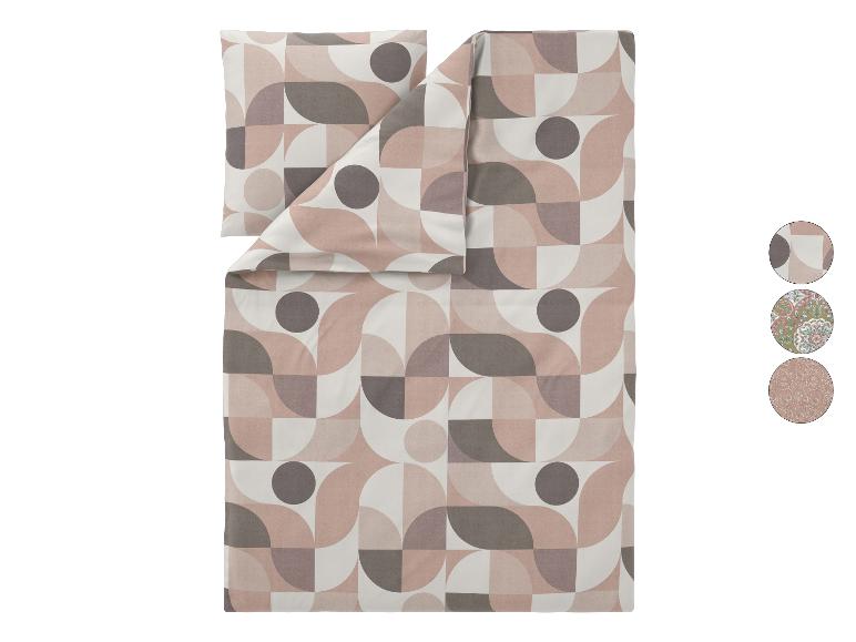 Bettwäsche-Set mit geometrischem Muster in Rosa, Grau und Weiß.