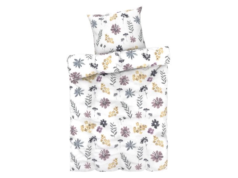 Bettenwäsche-Set mit Blumenmuster und Kissen.