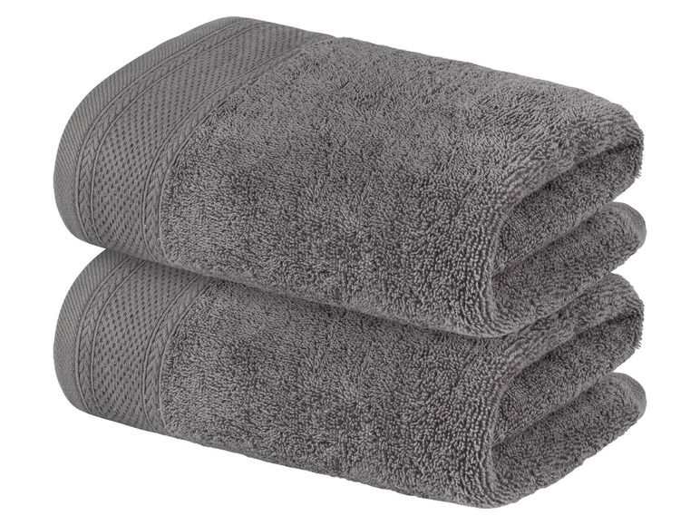 Zwei graue Handtücher, gefaltet