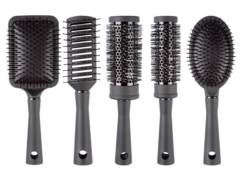 Ein Satz mit fünf schwarzen Haarbürsten, darunter zwei runde Bürsten.
