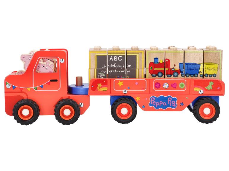 Ein roter Peppa Pig Spielzeuglastwagen mit Holzklötzen mit Buchstaben und Bildern.
