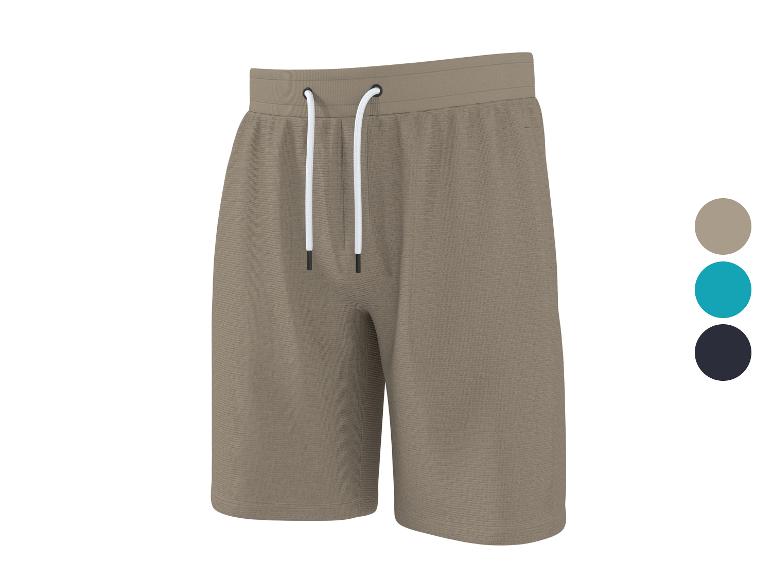 Beige Sweatshorts mit weißem Kordelzug, auch in Blau und Schwarz erhältlich.