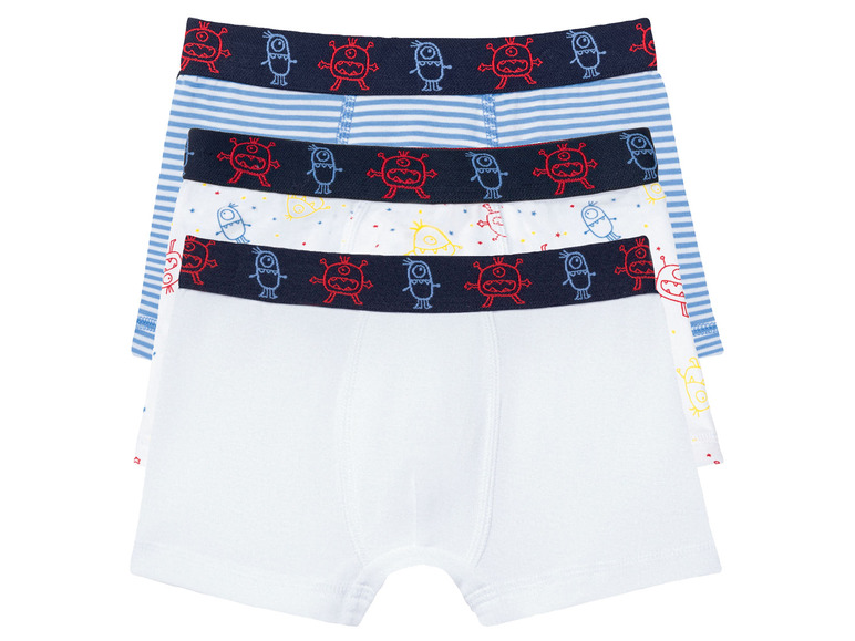 Drei Paar Jungenboxershorts mit Monster-Motiv.