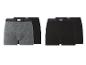 Zwei Packungen Looks Boxershorts in Grau und Schwarz.
