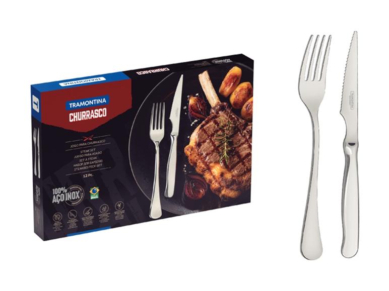 Steakbesteck-Set mit einer Box, die ein gegrilltes Steak und Gemüse zeigt.