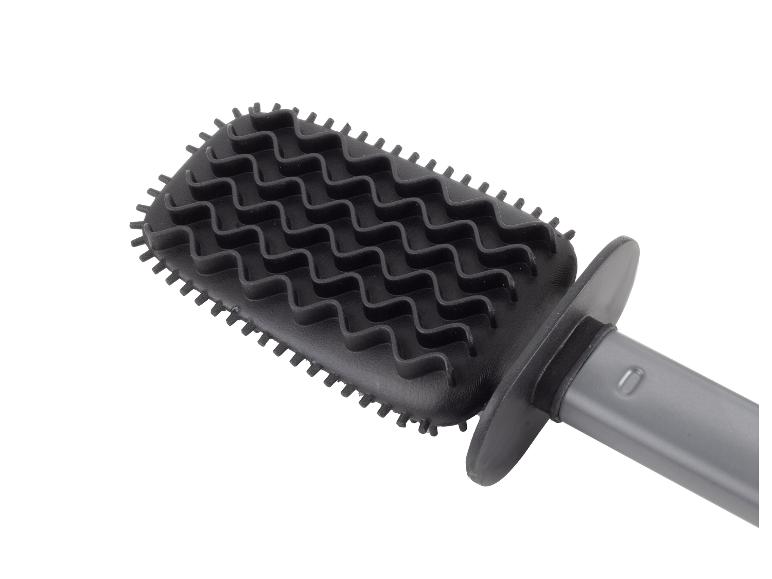 Schwarze Reinigungsbürste mit wellenförmigen Borsten und grauem Griff.