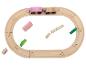 Holzspielzeug-Eisenbahnset mit einem rosa Zug und verschiedenen Blöcken.