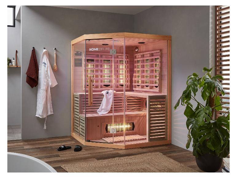HOME DELUXE Infrarotsauna in einem modernen Badezimmer mit Handtüchern und Pflanzen.