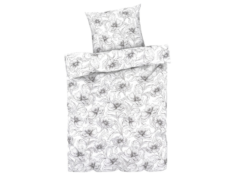 Ein weißer Bettbezug mit einem schwarz-weißen Blumenmuster.