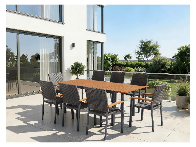 Gartenmöbel-Set mit großem Tisch und acht Stühlen auf einer Terrasse.