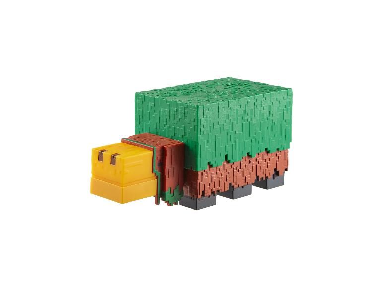 Blockartiges grünes und braunes Spielzeugtier mit gelbem Kopf