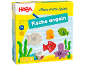 Kinderspiel Fische angeln in gelber Schachtel mit Holzfiguren von Meerestieren.